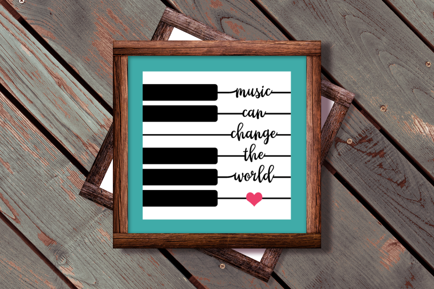 Piano key design that has the quote "music can change the world" and a heart incorporated into the white keys.