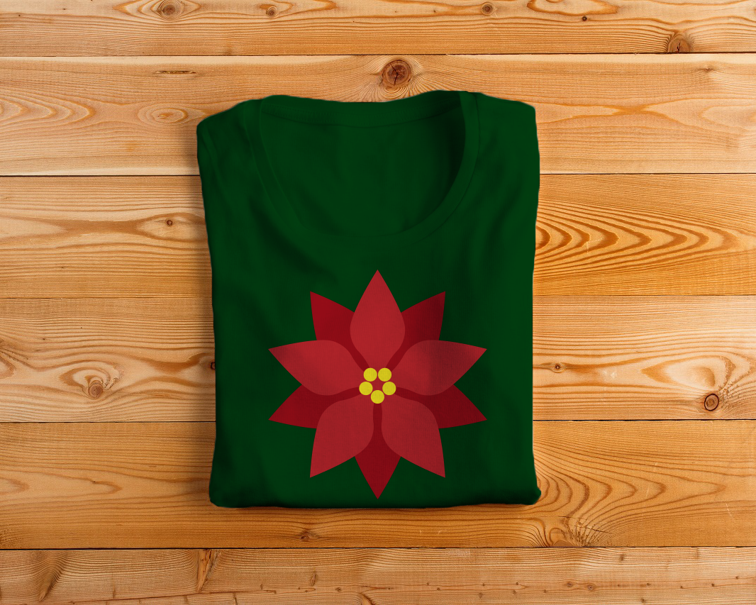A green folded tee with a poinsettia flower design.