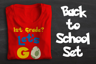 A red folded tee sits on a chalkboard backdrop. The shirt says "1st Grade? Let's GO" with a spotted cream and green egg in place of the O. To the right it says "Back to School Set."