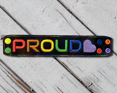"PROUD" embroidery design with a heart at the end.