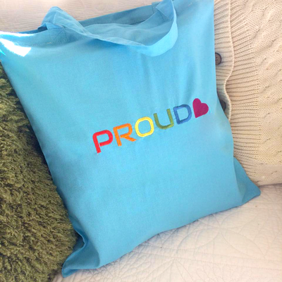 "PROUD" embroidery design with a heart at the end.
