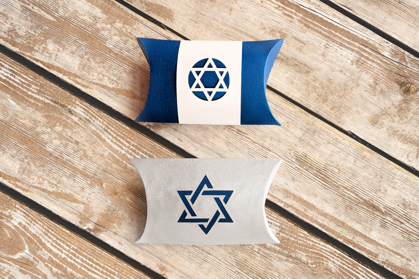 Pair of pillow boxes that have a Star of David motif.