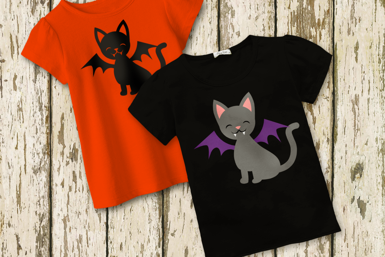 Two tees. Each has a cat with bat wings and vampire teeth.