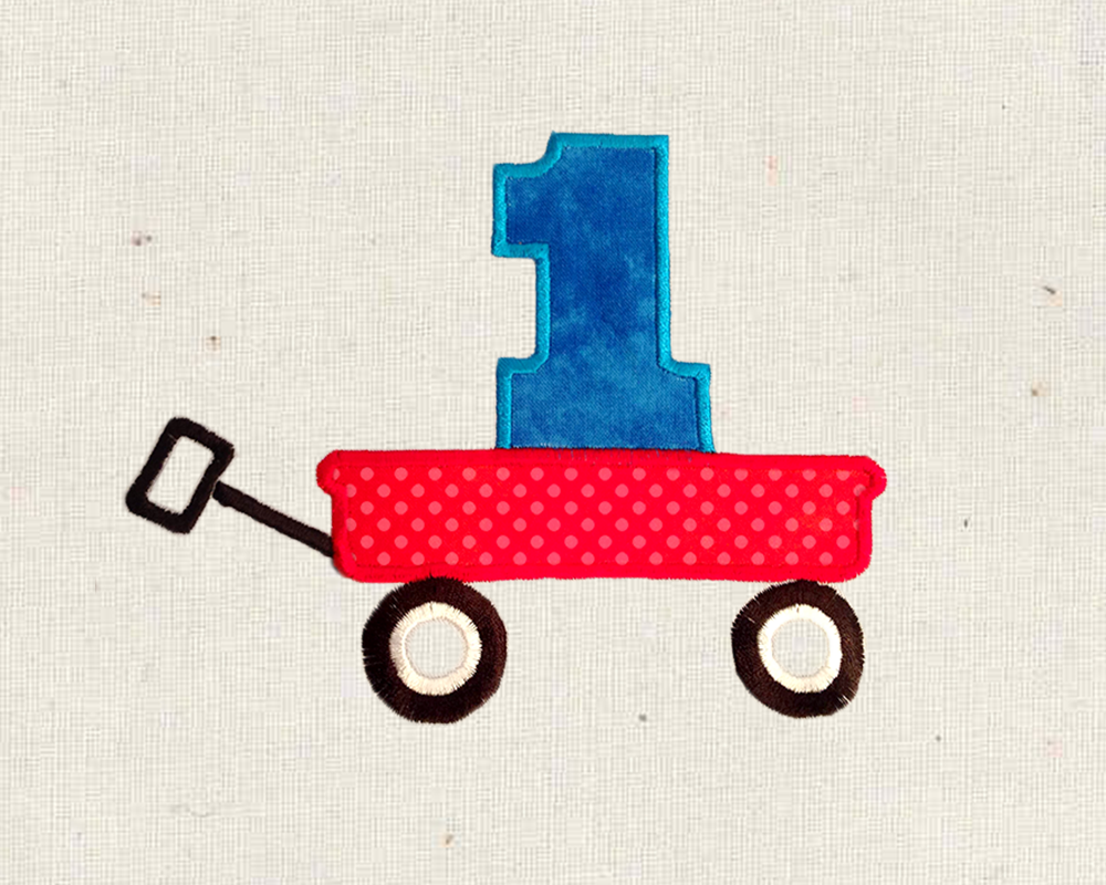 Applique toy wagon carrying a 1