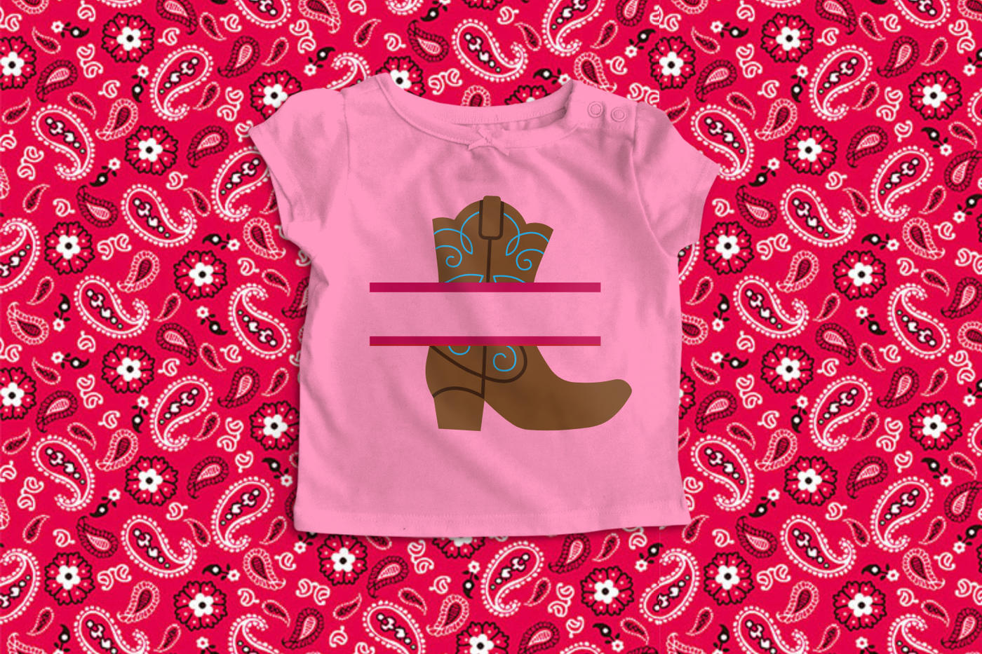 A pink tee with a fancy western boot on it with a split in the middle.