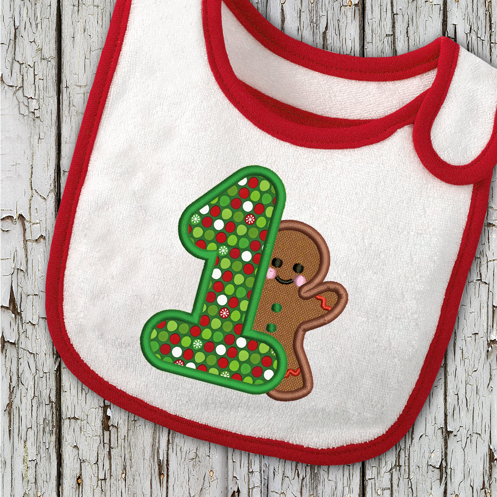 Bib with a large applique 1 and a gingerbread man.