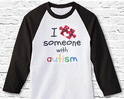 Applique design that says "I heart someone with autism." The heart is a puzzle piece with a heart shape for one of the notches.