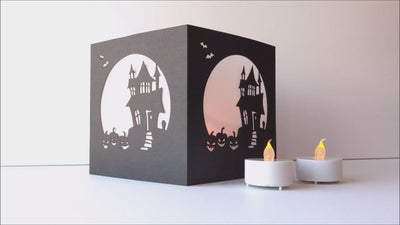 Haunted House luminary product demo video with flickering flameless candles
