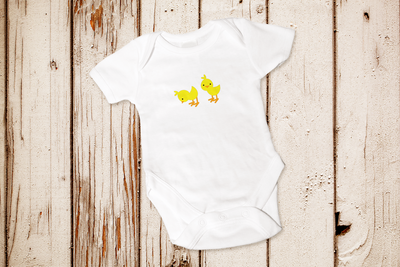 Baby chicks on a baby onesie.