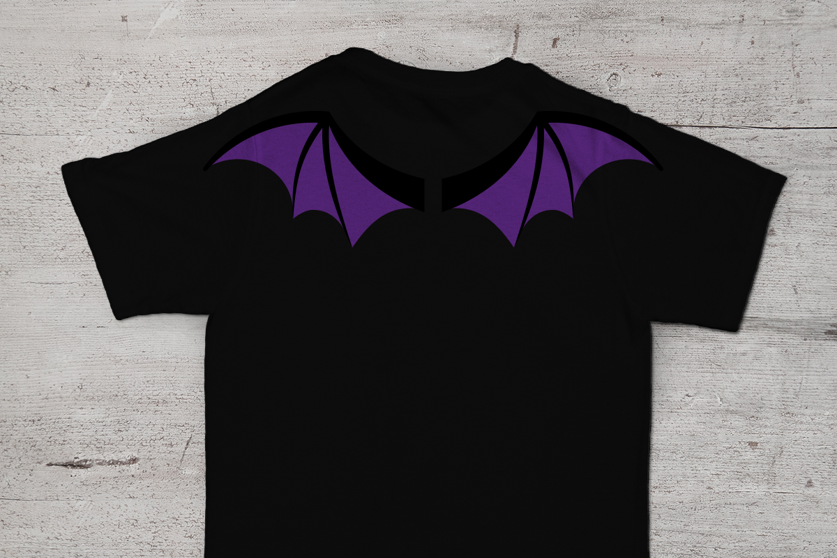 Back side of a black tee is visible. On the shoulders are a pair of purple and black bat wings.