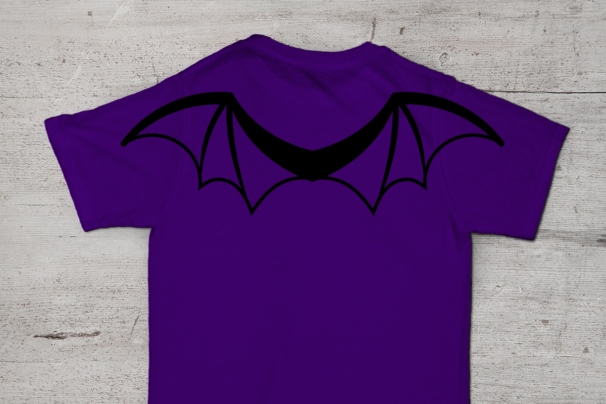 Back of a purple tee is visible. On the shoulders are a pair of black bat wings.