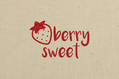 Beige fabric with red glitter vinyl design. Design says "berry sweet" with a strawberry.