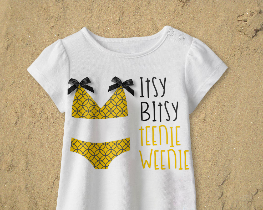 Shirt with a bikini design that has a circular pattern. Says "itsy bitsy teenie weenie."