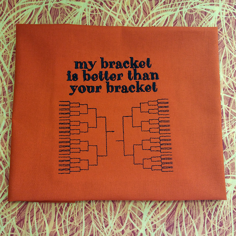 Embroidery design with brackets that says "my bracket is better than your bracket."