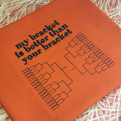 Embroidery design with brackets that says "my bracket is better than your bracket."