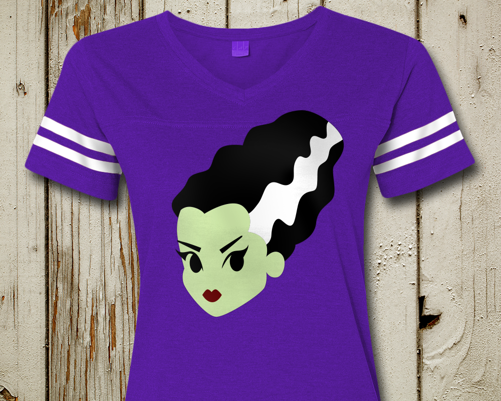 A purple shirt is decorated with the head of the Bride of Frankenstein. 