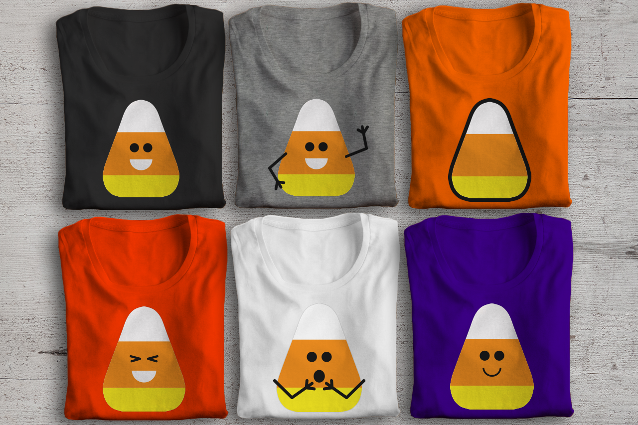 6 folded shirts in Halloween colors. Each has the image of a candy corn: Plain candy corn with black outline, Candy corn with open-mouthed smile, Candy corn with closed-mouth smile, Surprised candy corn, Happy waving candy corn, Laughing candy corn