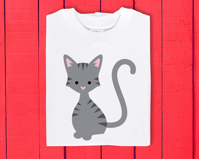 A folded shirt with a grey striped cat.