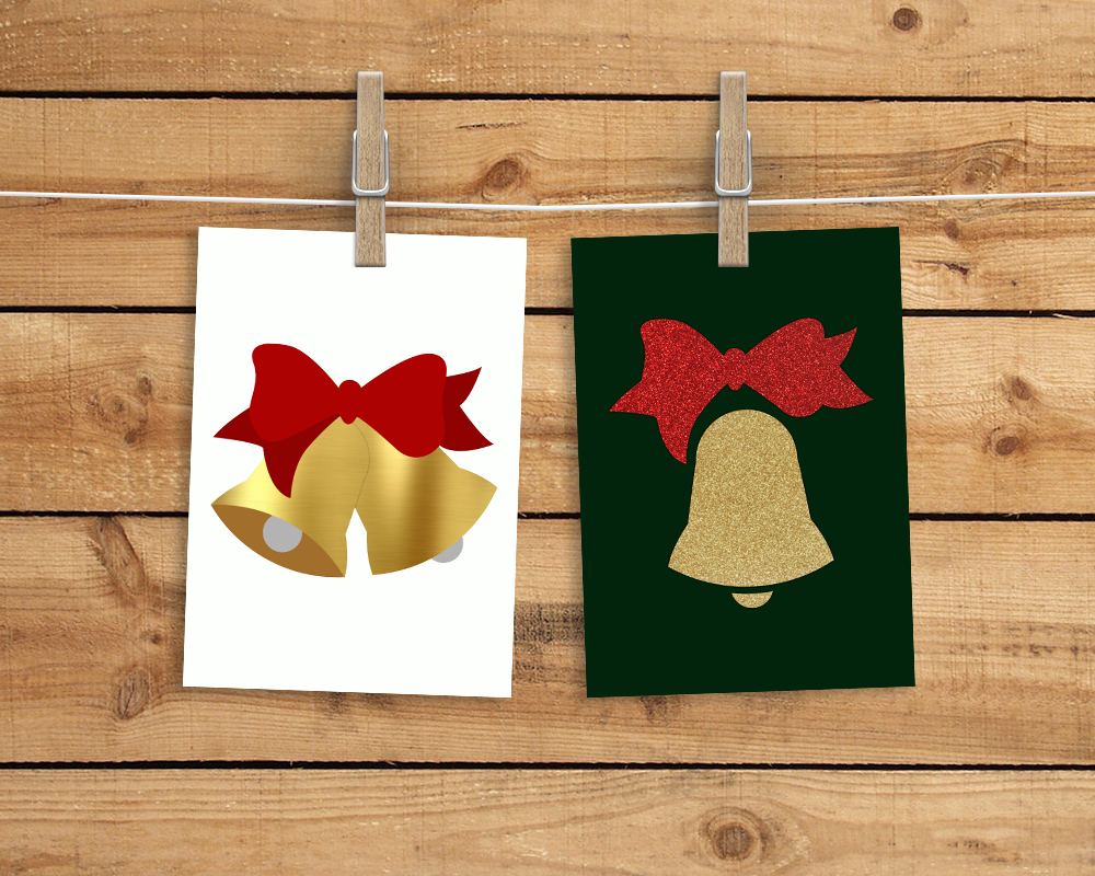 Two cards hanging from a clothesline. The left has 2 bells with a bow, the right has a single bell with a bow.