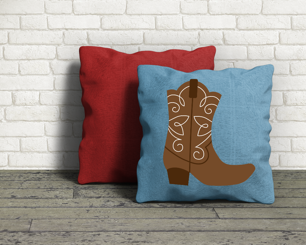Two throw pillows. One has the design of a western boot.
