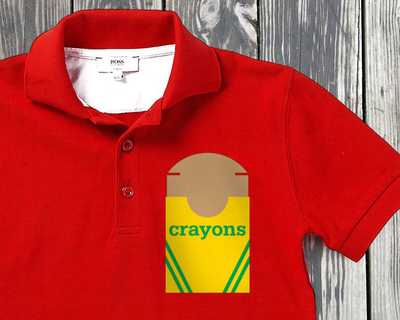 A red child's polo with an open crayon box design.