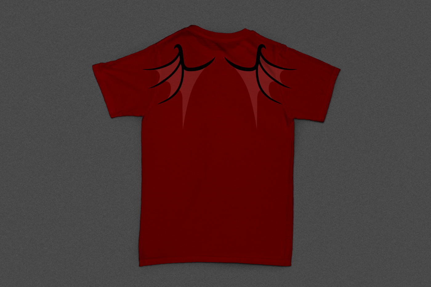 The back of a red shirt with dragon wing design on the shoulders.