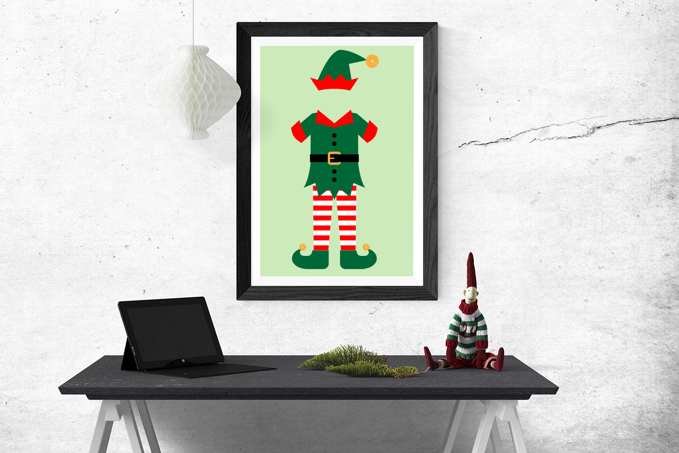 Poster above a desk has an elf outfit design.