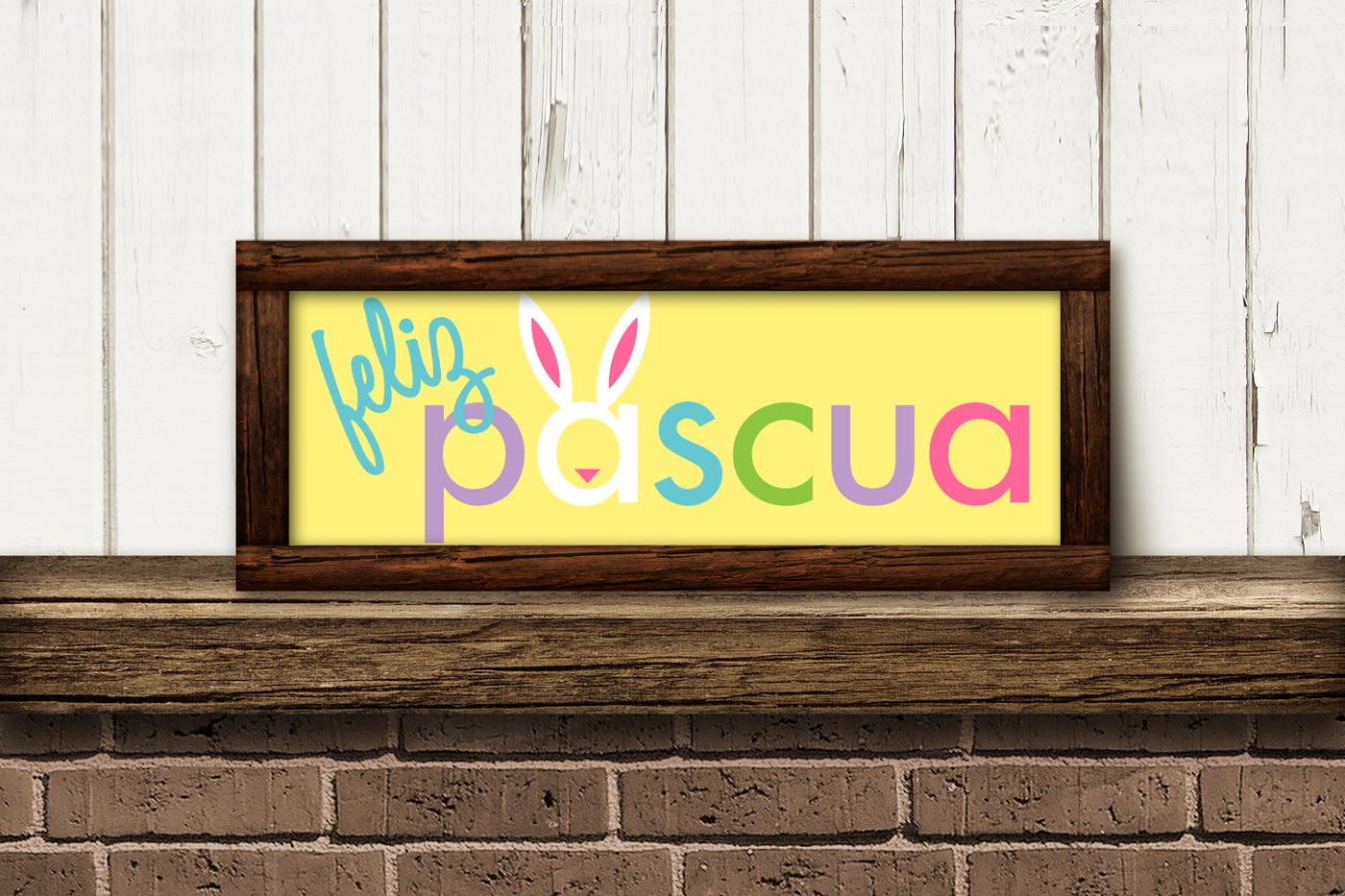 A horizontal sign that says "feliz pascua" with bunny ears and a nose on the first a.