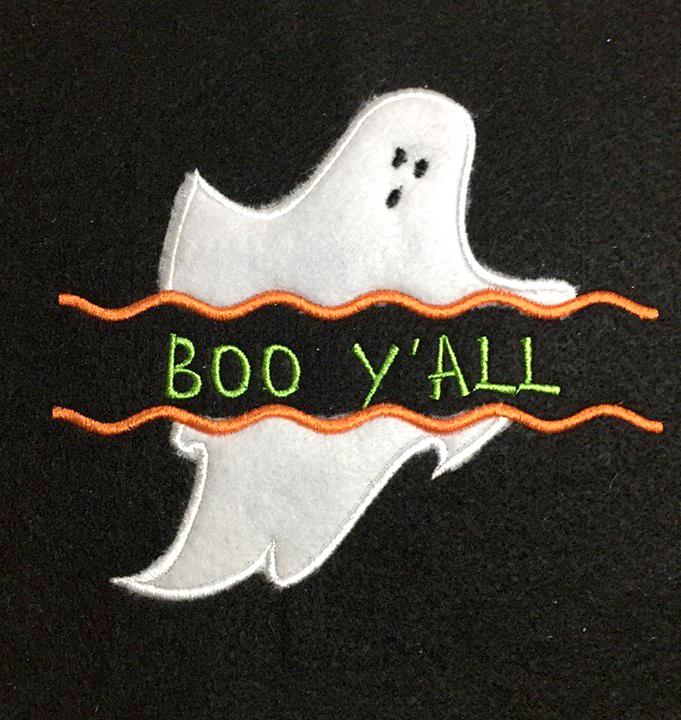 Ghost applique with wavy line split. Text has been added to the split space.