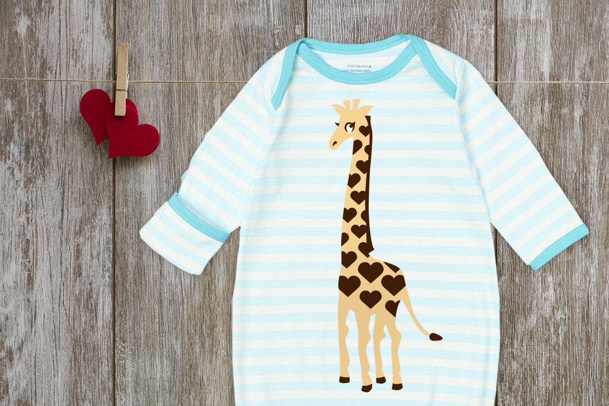 Baby nightgown with a giraffe design. Instead of the normal spots, there are hearts.