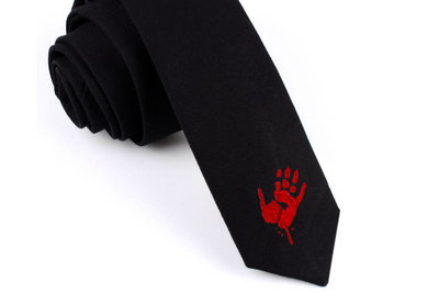 A black necktie with a red zombie hand print embroidered onto it.
