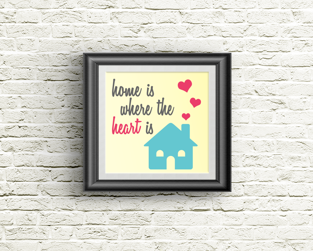 Framed square poster with the image of a house with hearts coming out of the chimney. It says "home is where the heart is."