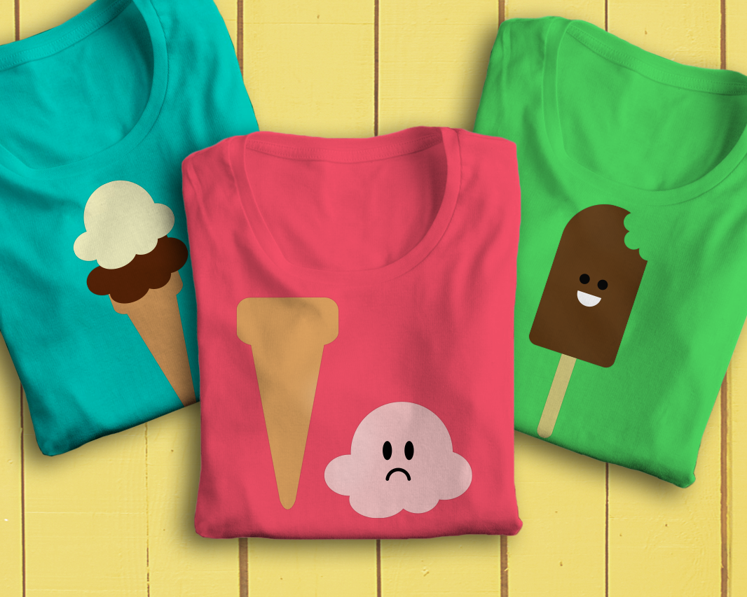 Three folded tees. The left tee has an ice cream cone with 2 scoops. The middle tee has an ice cream scoop that has fallen off the cone and has a frowny face. The right tee has a smiling ice cream bar with a bite taken out.