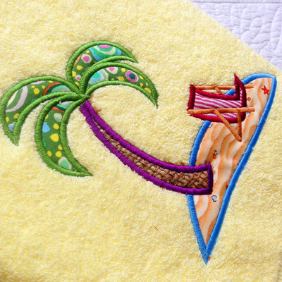Island with palm tree and beach chair applique