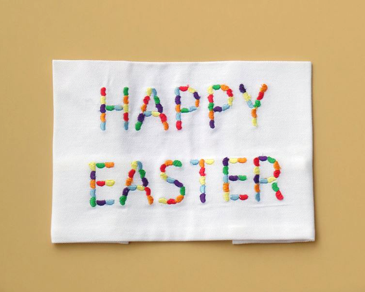 Embroidery design of Happy Easter spelled out in jelly beans.