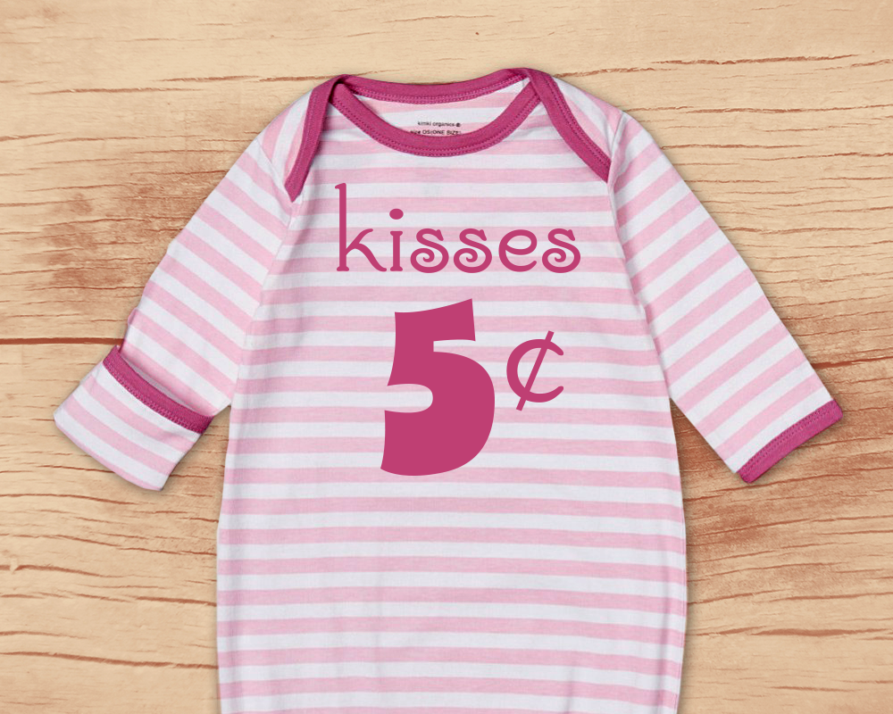 Baby nightgown with a design that says "Kisses 5 cents"