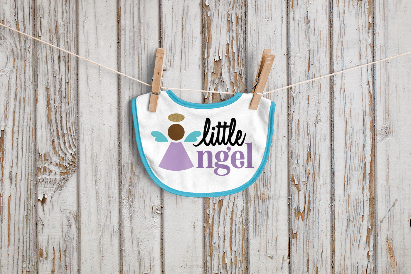 Bib with a simple angel design and the words "little angel." The Angel's body creates the A in Angel.