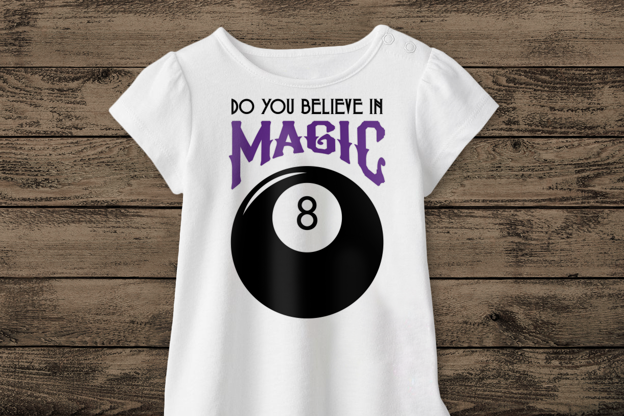 Shirt with an 8 ball that says "Do you believe in Magic" above it.