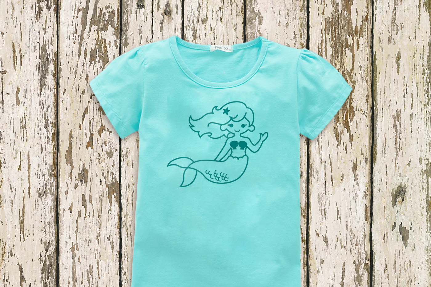 An aqua tee with a waving mermaid done in turquoise.