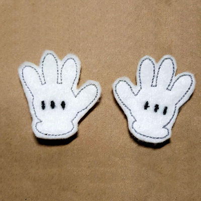 Two white cartoon glove felties. Shows a left and right glove.