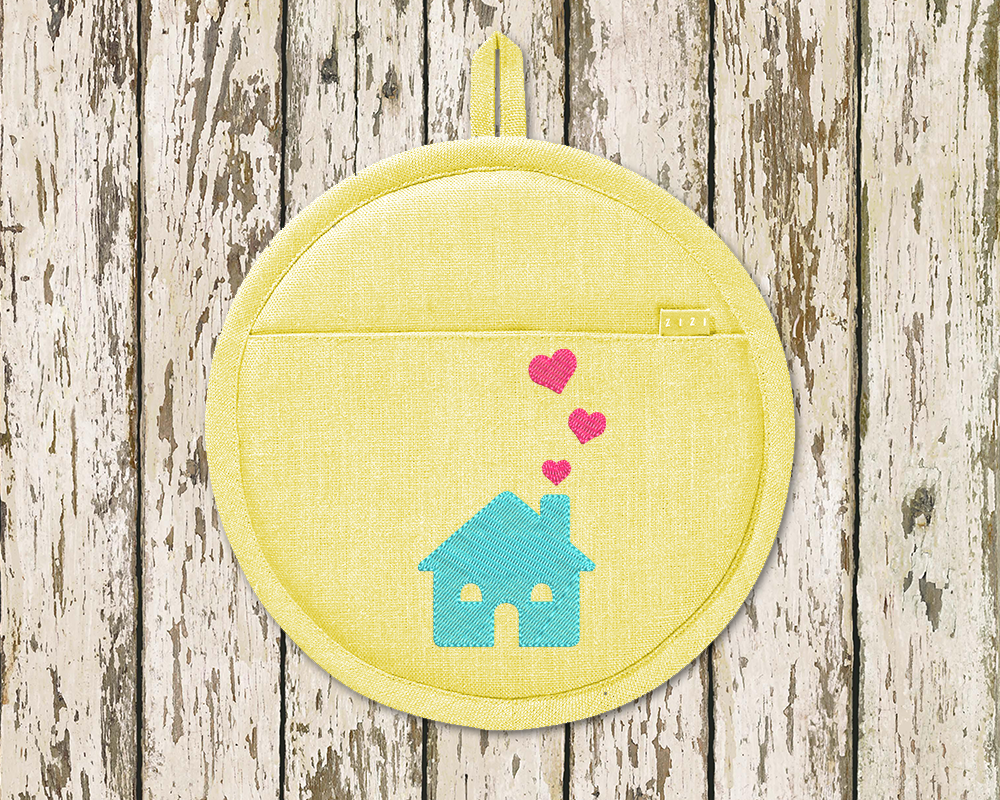Potholder with an embroidered house with 3 hearts floating up from the chimney.