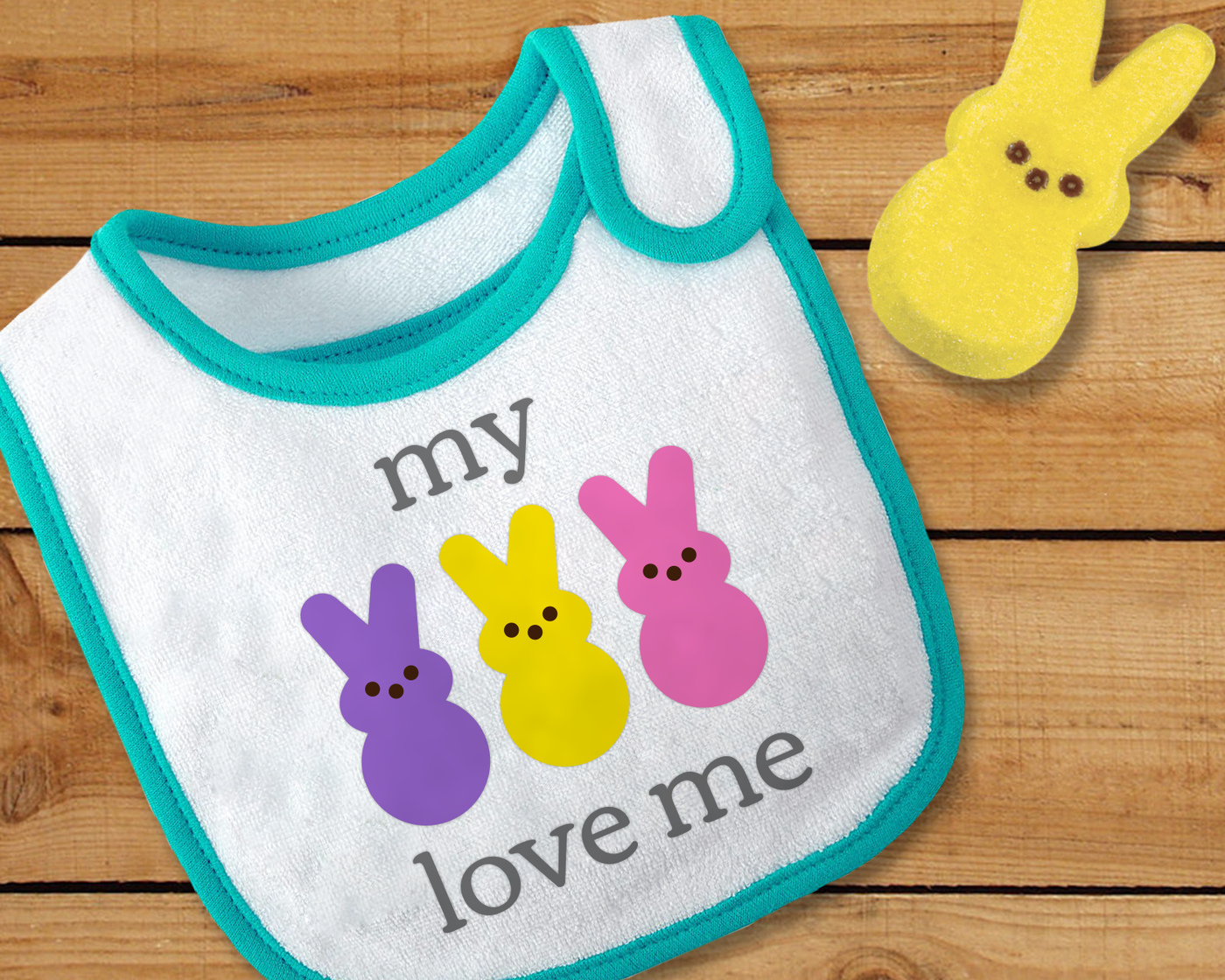 Bib with a design of 3 bunnies to complete the phrase "my [peeps] love me."