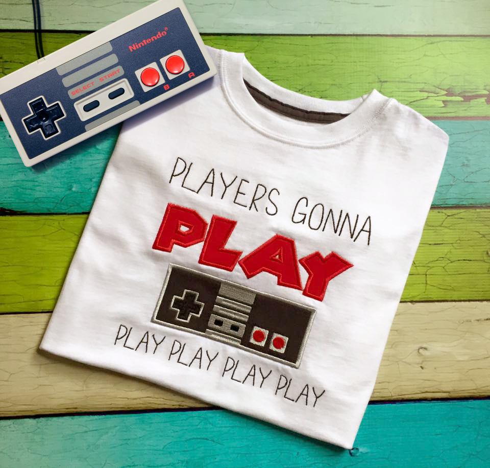 Applique design of a game controller that says "players gonna play play play play play"