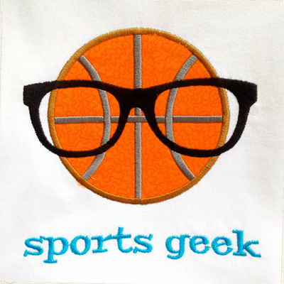 A piece of fabric embroidered with the words "sports geek" and an applique basketball wearing geeky glasses.