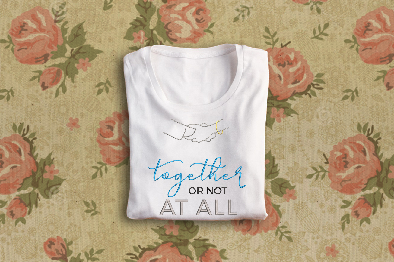 Embroidery design with clasped hands that says "together or not at all"